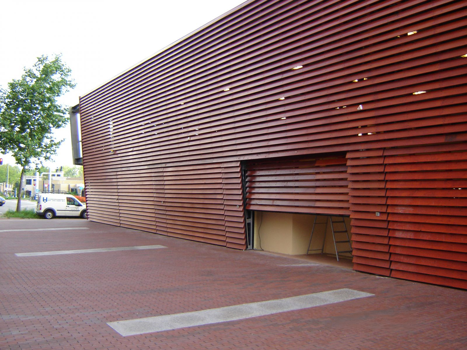 Logistical and industrial up and over doors, lined with veneer and wooden cladding
