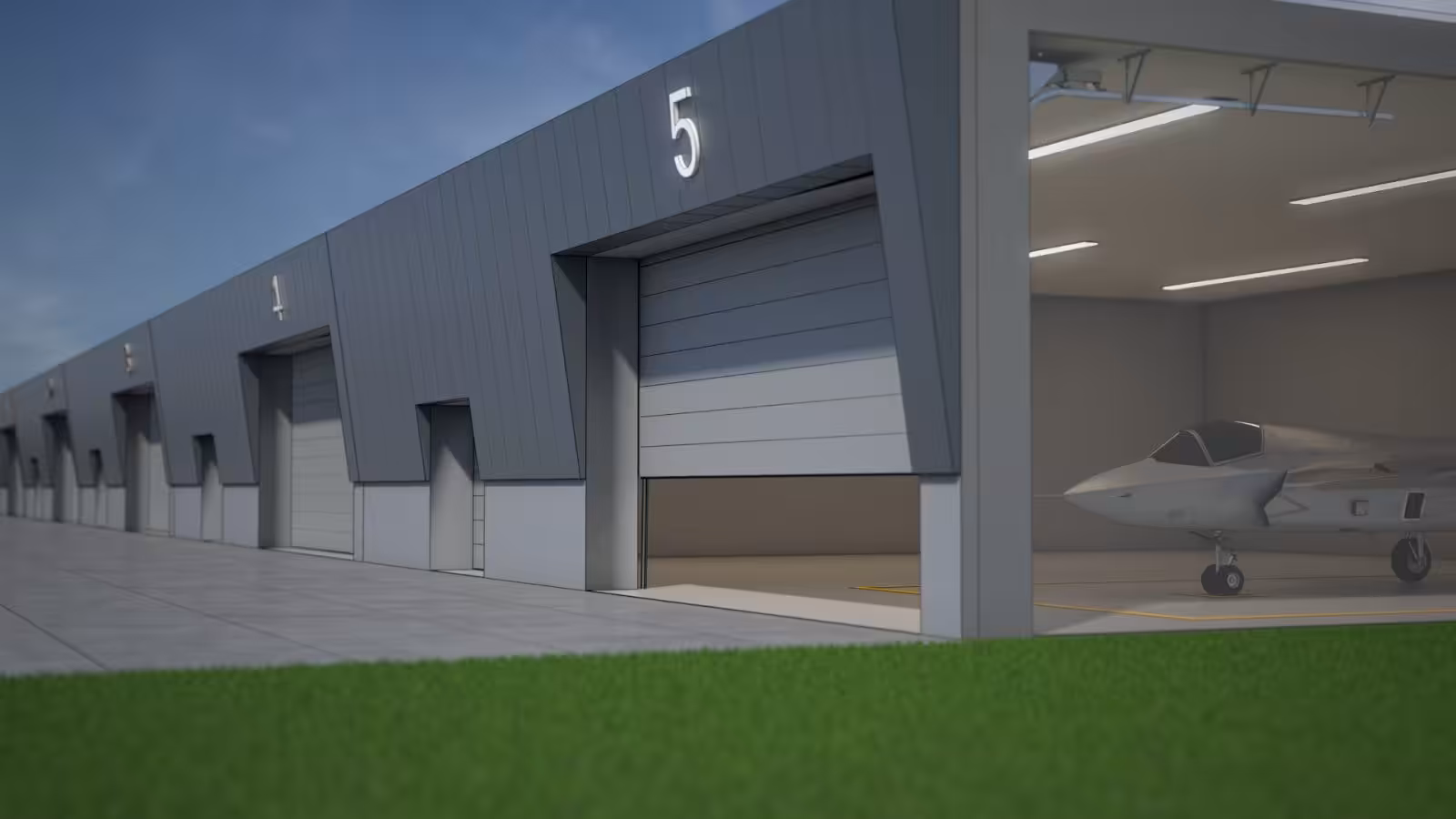 Slide visual: any specification, from design to completion. Showing a visual of security hangar doors at a military airport.