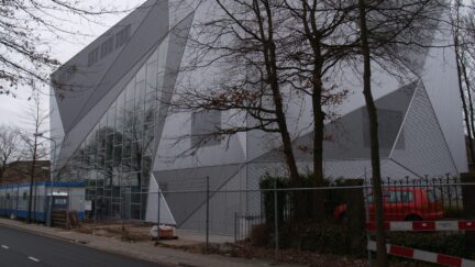 Esthetische deuren - sectionele schuifdeur bekleed met gevelmaterialen